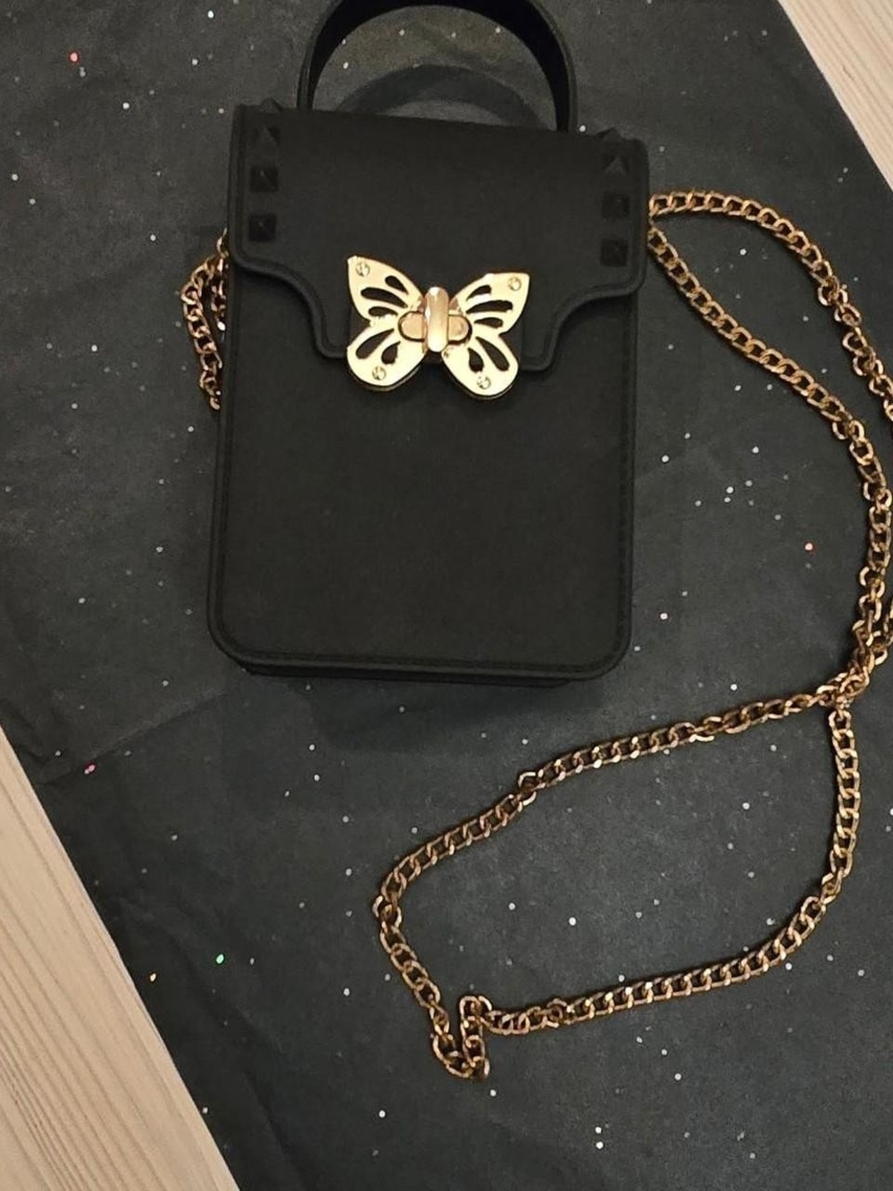 Black Crossbody Bag with Gold Butterfly Accent